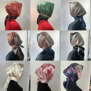Collage of nine satin square scarves featuring various retro floral and geometric prints