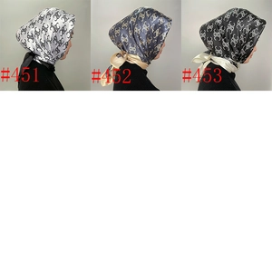 Detailed view of 90cm satin silk scarves featuring elegant geometric pattern prints