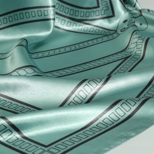 Elegant 90cm mint green silk square scarf with geometric black borders and sleek satin finish