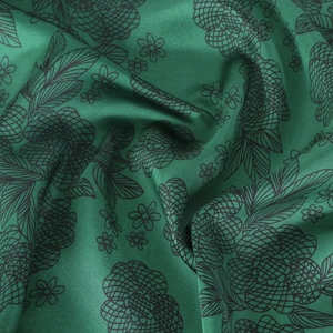Green satin leopard floral silk scarf with smooth glossy texture and elegant drape
