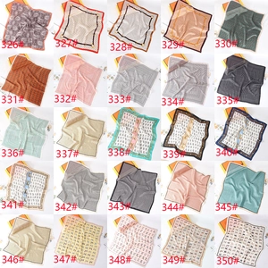Detailed grid showing multiple luxury leopard and geometric print square silk scarves