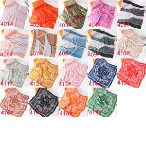 Detailed catalog showing 19 leopard and paisley pattern silk scarf designs in various colors