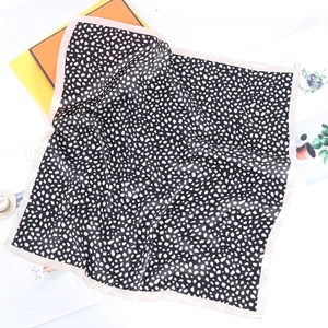 Square silk scarf with black white leopard polka dots and pink borders on white background