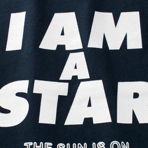 Kids long sleeve cotton T-shirt featuring I AM A STAR white slogan on dark navy fabric