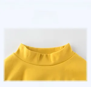 Close-up of bright yellow cotton turtleneck collar showing ribbed detail and stitching