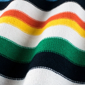 Vibrant knit sweater with bold orange, yellow, and green stripes for children