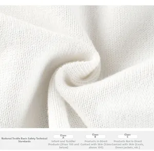 Close-up of white knitted fabric texture with GB 18401 textile safety standard details
