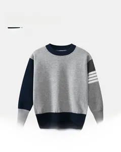 Detail of children's navy striped sweater showing cotton blend knit fabric and sleeve stripes