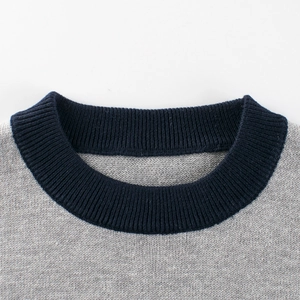 Light gray knit sweater for kids with a navy blue ribbed round neckline detail
