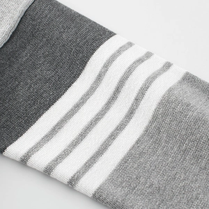 Kids grey knitted sweater sleeve featuring classic four white stripes design