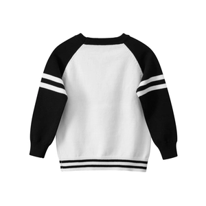 Classic kids black and white raglan sweater with striped sleeves on white background