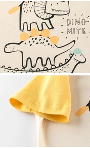 Detail of dino-mite print and raglan sleeve stitching on kids cotton t-shirt