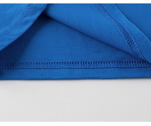 Detailed close-up of blue cotton kids T-shirt featuring high-quality double-needle stitching