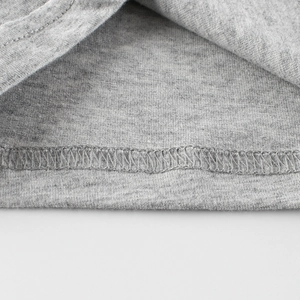 Gray cotton knit boy's T-shirt detail showing high-quality double-needle hem stitching