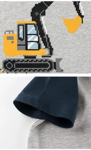 Detailed view of pixel art excavator print and sleeve stitching on cotton kids t-shirt