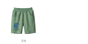 Détail du short enfant vert armoise avec imprimé de dessin animé Tyrannosaurus Rex