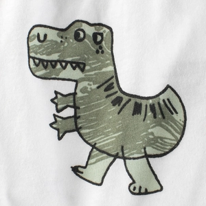 Kids white cotton shorts featuring a detailed cartoon green dinosaur print texture