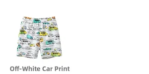Close-up of cream white children shorts featuring colorful cartoon car patterns and elastic waist