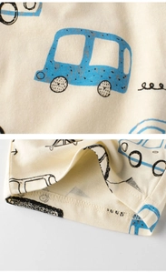 Detailed view of kids cotton shorts with blue cartoon car prints and double stitching