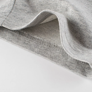 Close-up of grey heather knit cotton shorts with soft french terry lining and ribbed hem