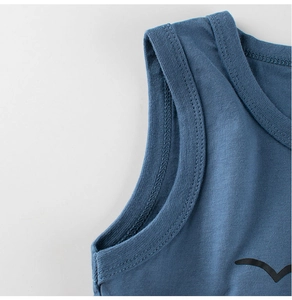 Detailed close-up of stitching and knit texture on navy blue cotton kids tank top