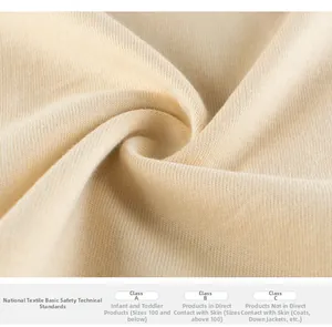 Detail of soft cream cotton knit fabric texture with safety certification standards