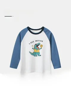 Close-up of raglan sleeve cotton T-shirt with T-Rex print for boys in blue and white