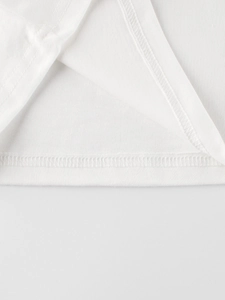 Close-up of high-quality white cotton long-sleeve T-shirt with durable double stitching