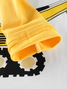 Kids long sleeve cotton T-shirt featuring yellow excavator print and durable cuffs