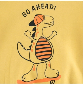 Detail of yellow cotton sweatshirt with GO AHEAD! cartoon dinosaur print on skateboard