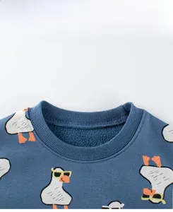 Detail view of ribbed neckline and fleece lining on blue cartoon duck print sweatshirt