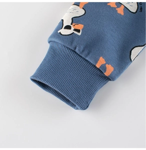 Detail of ribbed cuffs on grey-blue cotton sweatshirt with cartoon duck prints