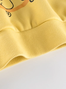 Kids yellow fleece sweatshirt with cartoon dinosaur print and ribbed cuffs for boys