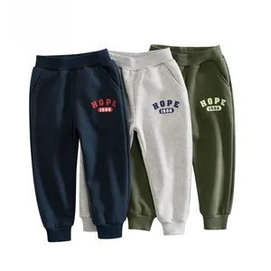 Detailed shot of three color kids fleece joggers featuring elastic waist and Hope 1986 text