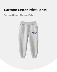 Detail of fleece-lined cotton blend fabric and HOPE 1986 print on gray kids joggers