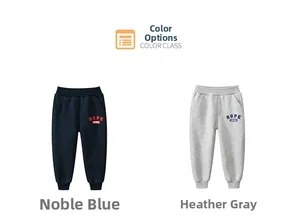 Close-up of kids joggers in navy and grey with Hope 1986 text and ribbed ankle cuffs