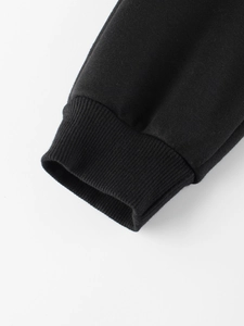 Classic black polar fleece kids pants featuring durable ribbed cuffs and premium cotton knit