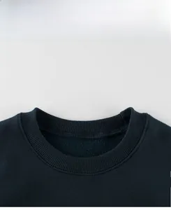 Close-up of navy blue crewneck sweatshirt with ribbed collar and warm fleece lining