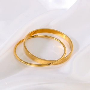 Polished 18K gold-plated stainless steel double-layer geometric bangles on silk