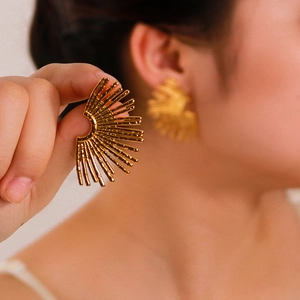 Modern hollow ray geometric 18K gold earrings with textured hammered finish for women