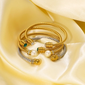 Spiral stainless steel open bracelets set with pearls and emerald zircons on silk