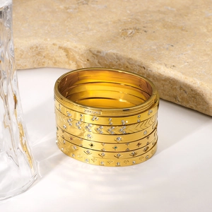 Six-piece set of 18K gold plated stainless steel bangles with diamonds and clover patterns