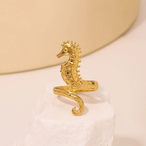 Golden seahorse hammered stainless steel ring featuring detailed marine animal texture