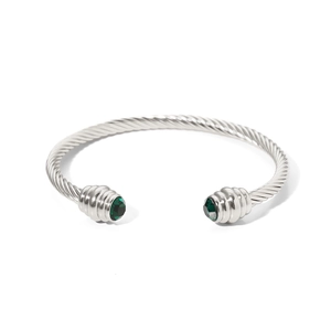 Silver twisted cable open bangle with 18K gold plating and emerald green gemstones