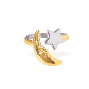 Minimalist celestial ring with gold crescent moon and silver star on open metal band