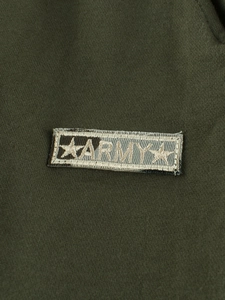 Detail of army style embroidery on olive green cotton knit joggers for toddler boys