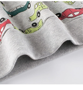 Close-up of ribbed cuffs on grey cotton sweatshirt with colorful cartoon car prints
