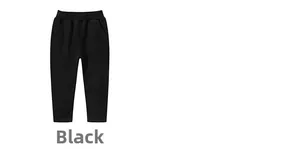 Detail view of children's black cotton sports trousers with an elastic waistband and side pockets