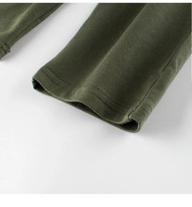 Detailed close-up of double-needle stitching on olive green cotton kids sports pants