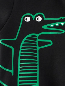 Kids black hoodie with green cartoon crocodile print showing detailed fabric texture